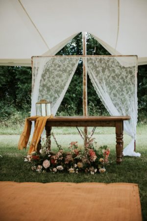 outside wedding ceremony under stretch tent