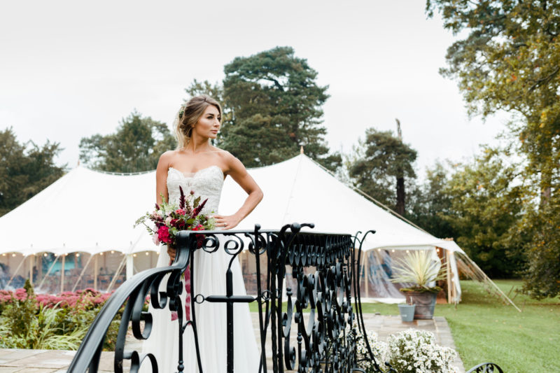 Bride standing outside a marquee