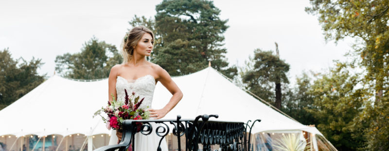 a bride standing outside a marquee in Cotswolds