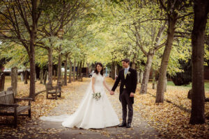 Autumn wedding Bride and Groom outside Church